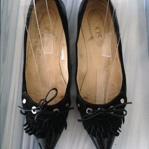 Black patent leather flats.